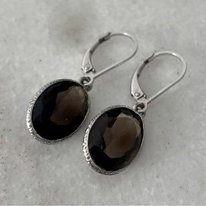 Grey semi-precious and silver oval drop earrings with claw clasp.